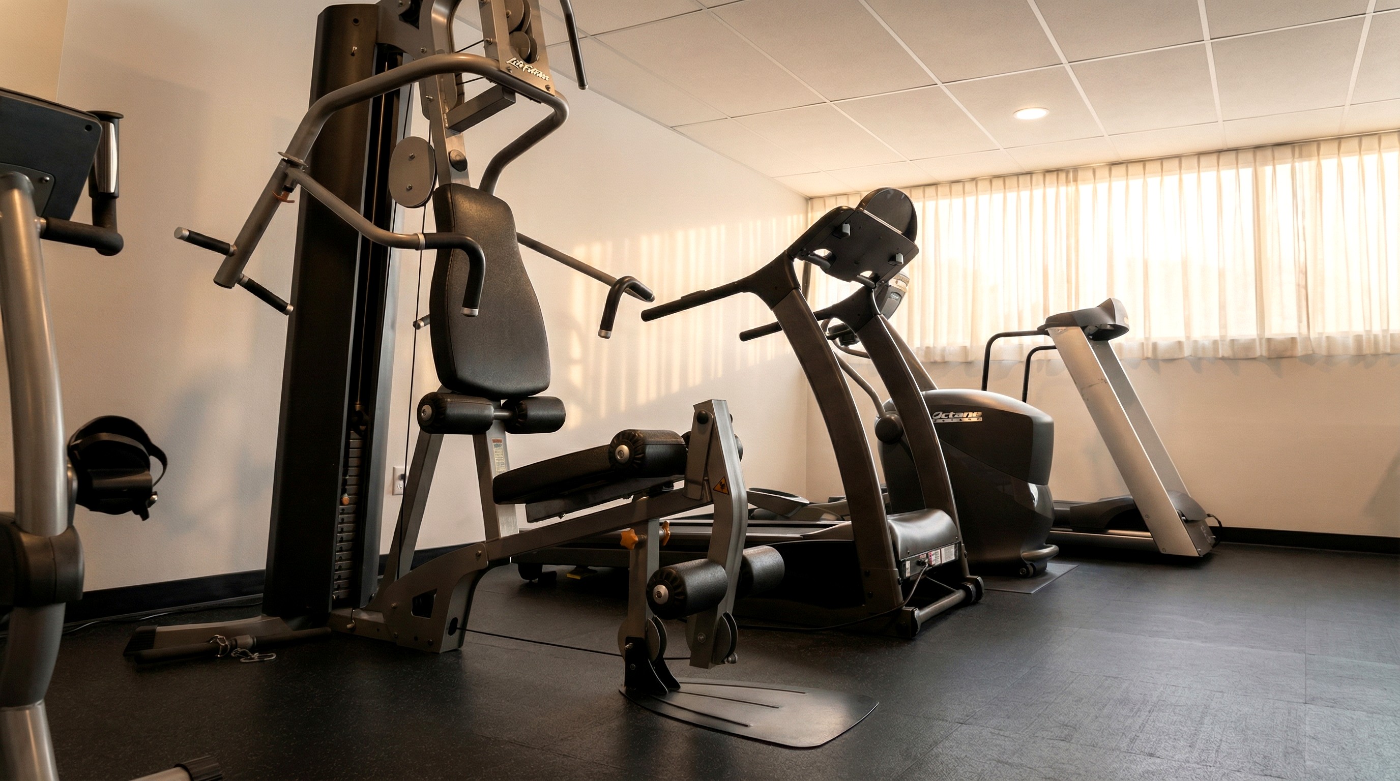 Fitness center at Adam's Airport Inn