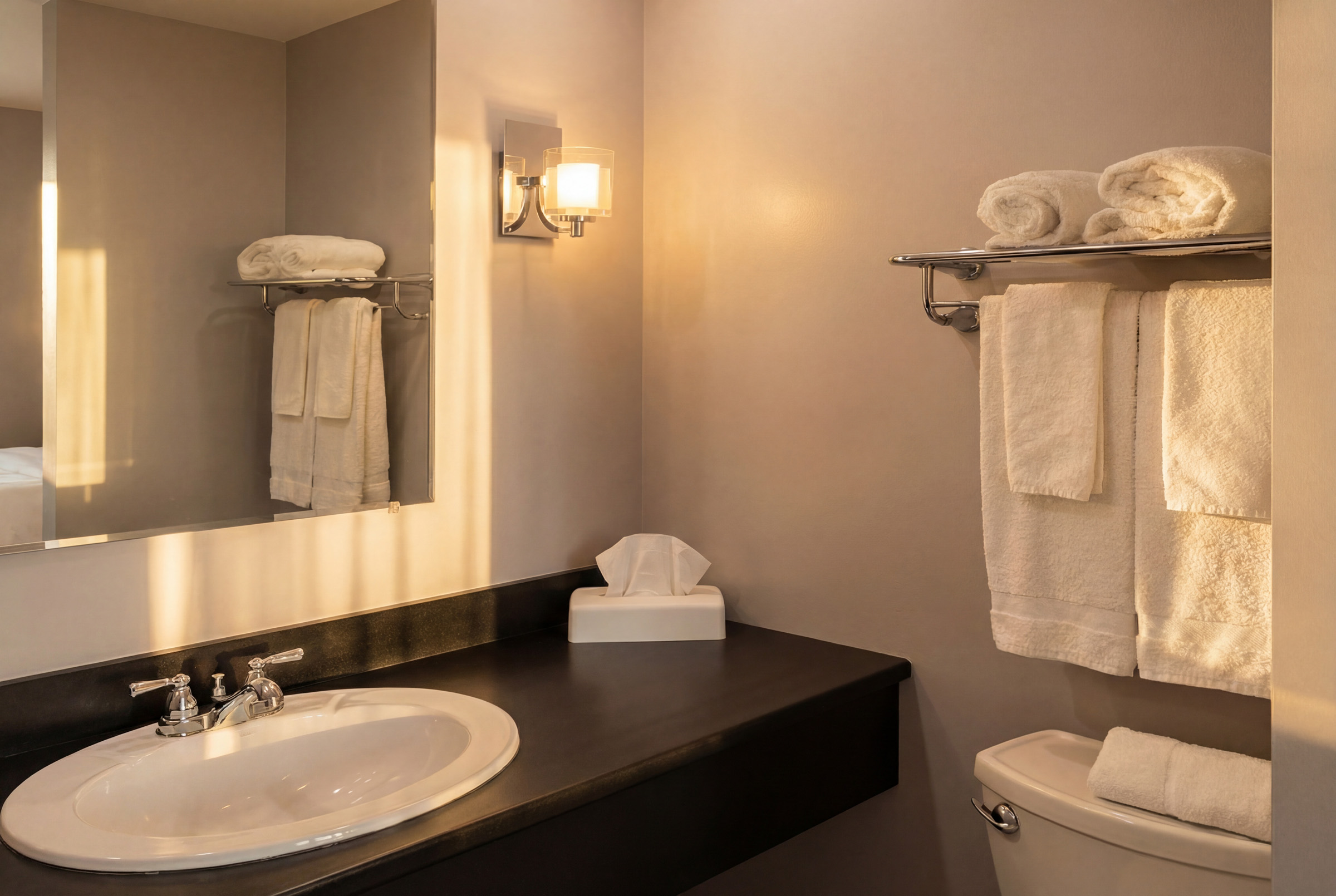 Private bathroom vanity with warm lighting